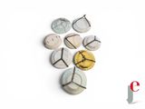 a picture of a group of clocks on a white surface