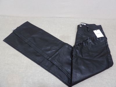 a close up of a pair of black leather pants on a white surface