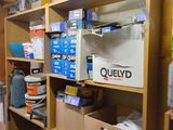 a room with a lot of boxes and containers on the shelves