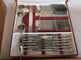 a box with silverware in it on a table