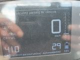 a close up of a parking meter with a hand on it