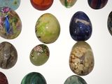 a lot of different types of marbles on the table