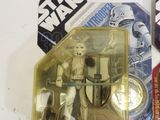 a star wars action figure on the table next to other action figures