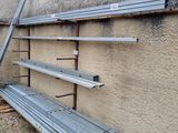 a bench that is leaning against a wall