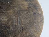 a close up of a wooden plate on a table