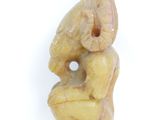an image of a figurine of a woman sitting on her knees