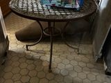 a table with a basket on top of it in a kitchen