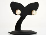 support en forme d'oreilles de chat noir surmonté de boucles d'oreilles en perles