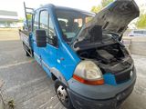 a small blue van with a broken hood sitting in a parking lot