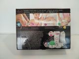 a box with a picture of a woman getting her nails done