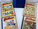 four children ' s books are lined up on a white surface