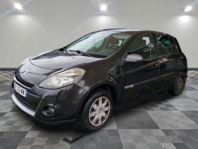 a picture of a small black car parked in a garage