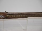 an old gun that is on display in a museum