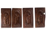 three wooden plaques depicting a woman and a man
