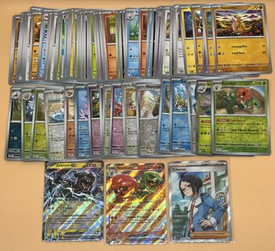 beaucoup de cartes pokemon différentes sur la table