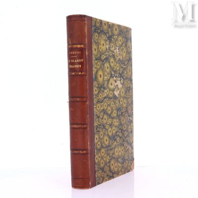 an old book that is sitting on a white surface