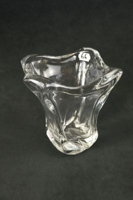 clear glass vase on a black background with a black background