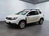 the white dacia is parked inside of a white room