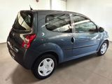 a picture of a small blue car parked in a garage