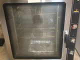 an image of a toaster oven sitting on the floor