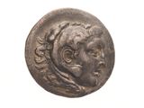 a close up of a coin with a woman ' s face on it