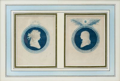 two framed blue and white portraits of two men