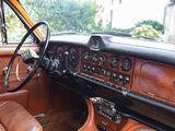 a dashboard and steering wheel of a classic car