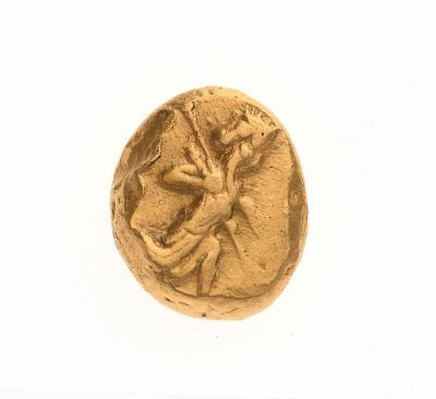 une pièce d'or à l'effigie d'une femme