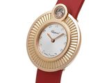an image of a close up of a wrist watch with a red strap