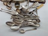 a lot of silver spoons and spoon spoons on the table
