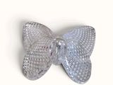 a glass bow on a white surface with a white background