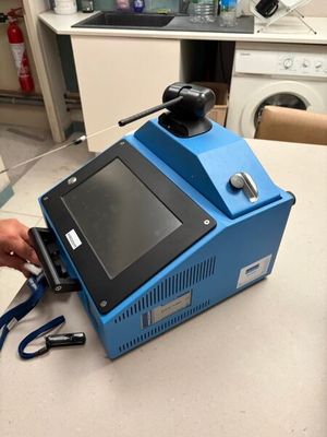 a blue machine that is sitting on a counter