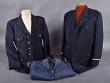 two men ' s jackets and a shirt on a mannequin stand