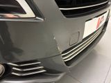 a close up of a car ' s front bumper with a number plate on it