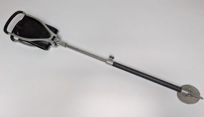 a black and white photo of a shovel and a black and white object