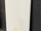 a picture of a white board leaning against a wall