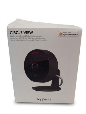 the box of the apple homekit camera is open on a white surface