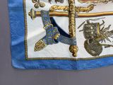 a blue and white flag with a picture of an eagle and a sword