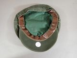 a green hat with a brown brimle on top of it
