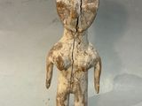 a small figurine of a person with a broken arm