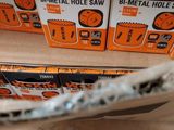 boxes of wokin b - metal hole saw sitting on top of a table