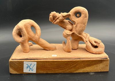 a clay sculpture of a man and a woman on a bench