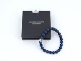 a bracelet with a black box and a blue beaded bracelet