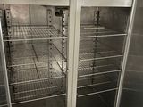 stainless steel double door freezer in a commercial kitchen