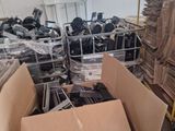 many boxes of electronic equipment in a room
