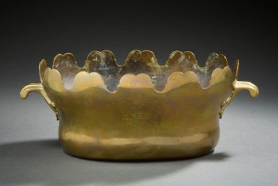 an image of a gold vase with a decorative design on it
