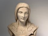 a statue of a woman holding a baby in her arms