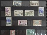 the collection of stamps are on display in a black frame