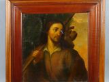 an oil painting of a man holding a bird in a wooden frame