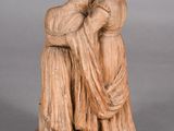 statue of a woman holding a child in her arms